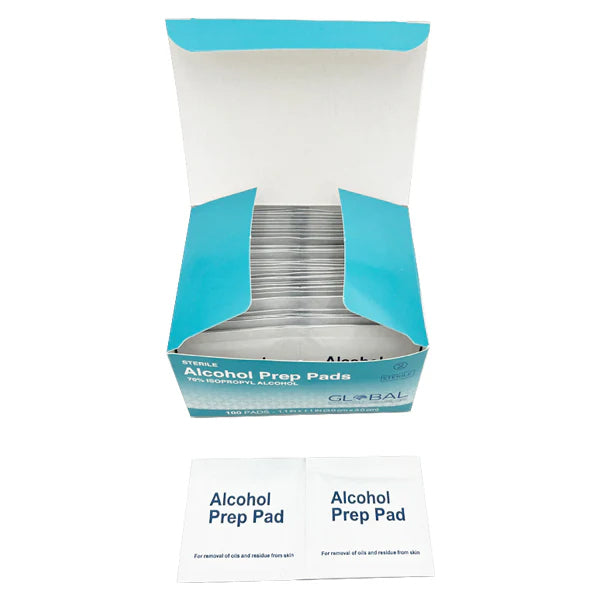 An open box of Global Med Groups 12 Pack - Sterile Alcohol Prep Pads 70% Isopropyl (3x3cm, 1200 pads total), with two individually wrapped pads displayed in front.