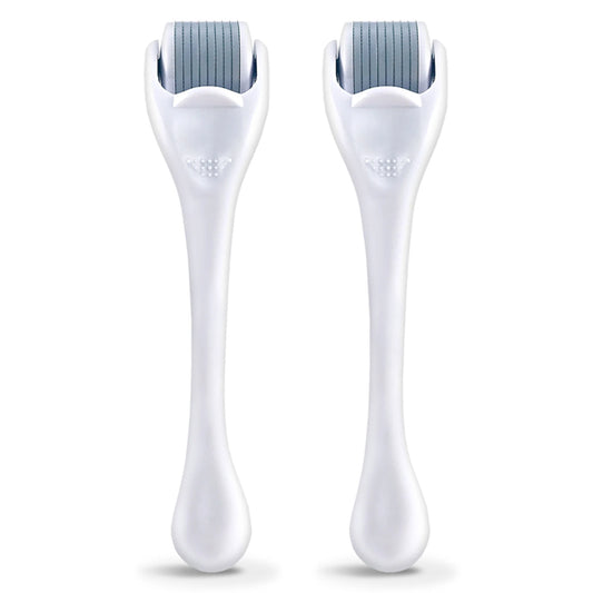 The 2 Pack - Plum Beauty Facial Microneedling Facial Roller and Massager in White by Plum features two cylindrical rollers with fine needles—ideal for boosting collagen and revealing smoother, more youthful-looking skin.