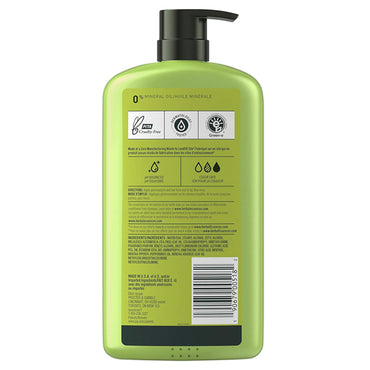 Back of a green Herbal Essences 2 Pack Purifying Conditioner Tea Tree 29.2oz bottle with black pump, showing product info, ingredients with tea tree, barcode, plus vegan and cruelty-free certification icons.