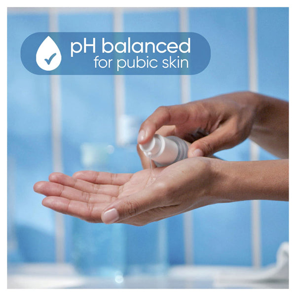 A person dispenses Gillette Venus Intimate Grooming Daily Soothing Serum (2 Pack, 1.7oz each) into their hand, with text above reading pH balanced for pubic skin and enhanced skin hydration.