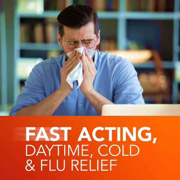 A man sits at a desk blowing his nose into a tissue, with text overlay reading Fast Acting, Daytime, Vicks 2 Pack - DayQuil Severe Cold & Flu Medicine LiquiCaps 24ct relief.