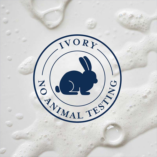 Circular Ivory No Animal Testing logo with rabbit icon on a foamy white background features Ivory Mild & Gentle Body Wash, Lavender Scent 1.03L (4 Pack)—crafted by Ivory with plant-based cleaners for a gentle cleanse.