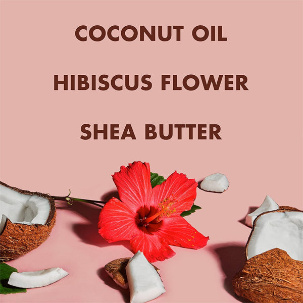 A hibiscus flower rests amid cracked coconuts on a pink surface, with text above reading SheaMoisture 2 Pack – Body Scrub for Dull Skin Coconut & Hibiscus, 12oz, Exfoliating Body Scrub with Shea Butter.
