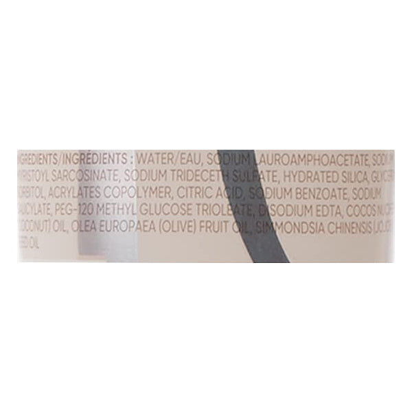 Close-up of a Gillette Venus Intimate Grooming Skin-Smoothing Exfoliant label (2 Pack, 6oz) showing ingredients in small, light text on beige background. This pre-shave exfoliant helps prevent ingrown hairs.
