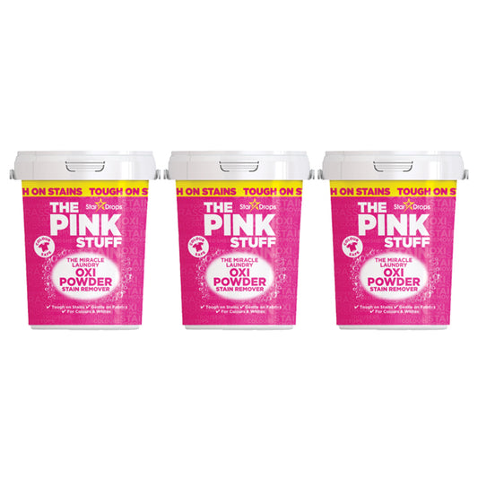 Three 2.2lb containers of Star Drops 3 Pack - The Pink Stuff Miracle Laundry Oxi Powder Stain Remover for Colors are displayed side by side, each with a bright pink label and white lid.