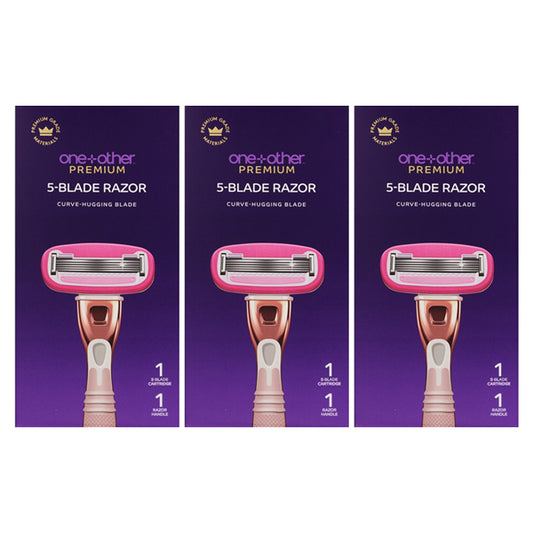 Three boxes of one+other Blissfully Smooth 5-Blade Razor, each with curve-hugging blades and a lubricating surround, featuring a pink and rose gold razor on a purple background.