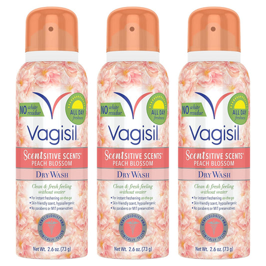 Three cans of Vagisil Scentsitive Scents Feminine Dry Wash Deodorant Spray 2.6oz each are displayed side by side, featuring peach floral designs—ideal for freshening intimate skin. 3 Pack from Vagisil.