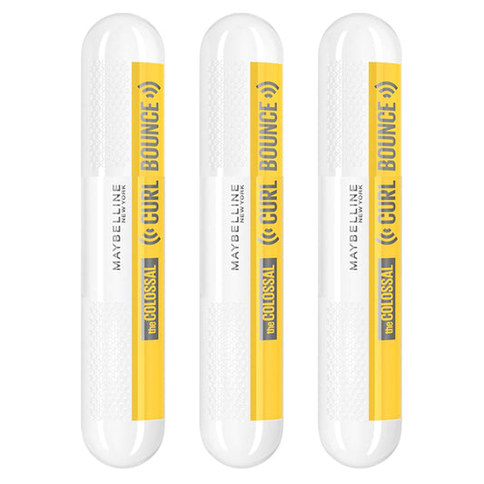Three Maybelline Volum Express Colossal Curl Bounce Mascara Blackest Black tubes are displayed upright, showcasing this volumizing, long-wearing mascara by Maybelline with a curling effect.