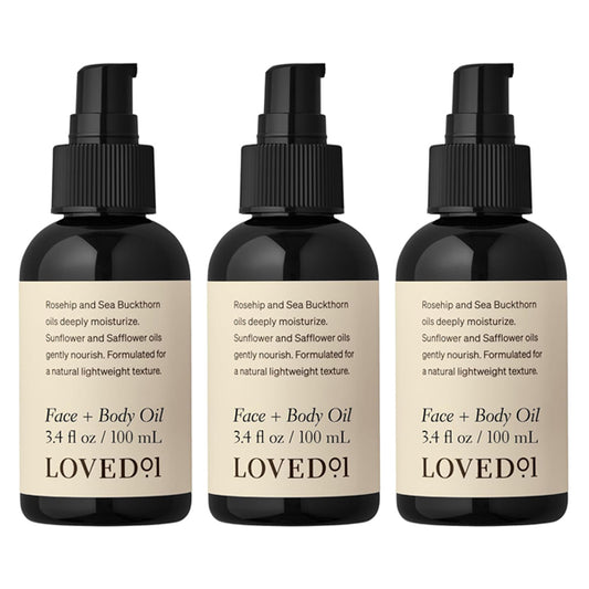 The Loved 01 3 Pack Face + Body Oil with Rosehip & Sea Buckthorn (3.4oz each) hydrates and nourishes skin, featuring beige labels with ingredients and details.