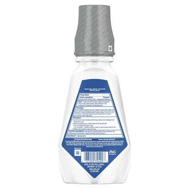 Back view of a Crest Gum Care Mouthwash Cool Wintergreen with CPC 16.9oz bottle (part of 4 Pack), gray cap, showing label with drug facts, gum care instructions, and Crest manufacturer information.