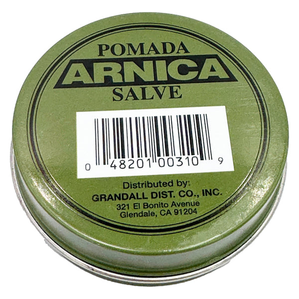 Round tin labeled Pomada 3 Pack - Arnica Salve First Aid Antiseptic 1oz, with arnica extract for antiseptic use. Barcode and distributor info on lid. Brand: Pomada. Distributed by Grandall Dist. Co., Inc., Glendale, CA.