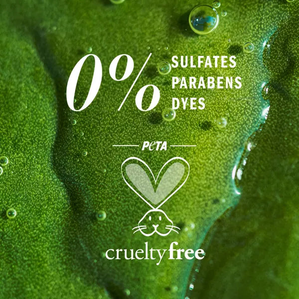 Close-up of a green leaf with water droplets and text: 0% sulfates, parabens, dyes—ideal for those seeking gentle care. Herbal Essences Apricot Oil Curl Defining Shampoo 3 Pack is PETA cruelty-free (heart & bunny logo) and sulfate-free.