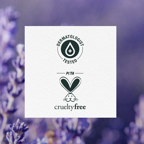Herbal Essences 3 Pack - Jojoba Oil & Lavender Curls Shampoo 29.2oz shows dermatologist tested and PETA cruelty-free logos on a white square over a blurred lavender floral background.