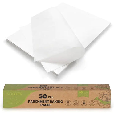 Two sheets of white Kootek parchment paper, essential baking accessories, are displayed above a brown box labeled 4 Pack - Parchment Paper Baking Sheets 12 x 16 Inch 50 Count Each.