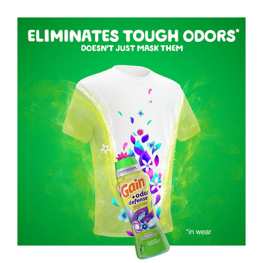 A white t-shirt with floral graphics is surrounded by green mist. In front, a 5 Pack of Gain + Odor Defense In-Wash Scent Booster Super Fresh Blast Scent is shown. Text above reads: Eliminates tough odors for lasting freshness.