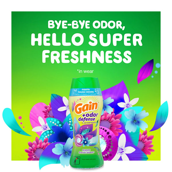 A 5-pack of Gain + Odor Defense In-Wash Scent Booster, Super Fresh Blast Scent (5.7 oz each), is displayed among vibrant flowers and greenery, with the tagline: “Bye-Bye Odor, Hello Lasting Freshness.”.