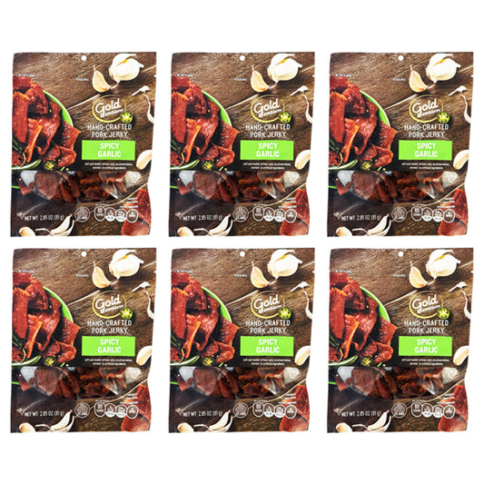 Six packs of Gold Emblem Spicy Garlic Hand Crafted Pork Jerky (2.85oz each) are arranged in two rows of three. The preservative-free packaging features garlic cloves and herbs.