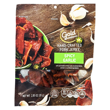 Gold Emblem Spicy Garlic Hand Crafted Pork Jerky 2.85oz, sold in a 6 pack, features jerky pieces and garlic cloves on the package—an ideal preservative-free snack.