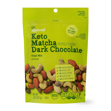 A 6-pack of Gold Emblem Abound Keto Matcha Dark Chocolate Trail Mix, 6oz resealable bags with nuts and matcha dark chocolate pieces—ideal for low-carb snacking.