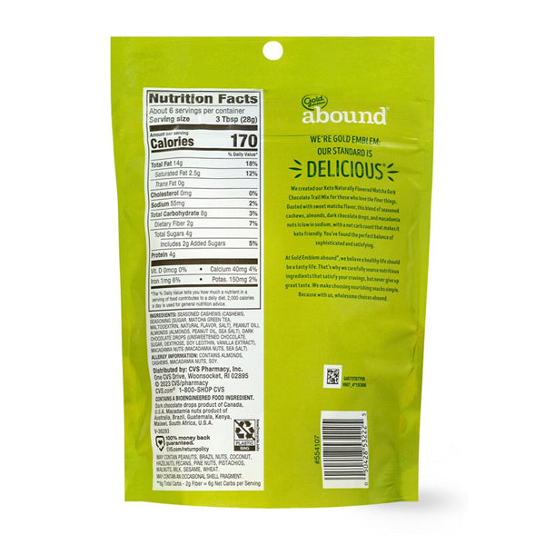 Back of a green Gold Emblem 6 Pack - Abound Keto Matcha Dark Chocolate Trail Mix 6oz package displaying nutrition facts, ingredients, brand info, and barcode—ideal for low-carb or keto snack seekers.
