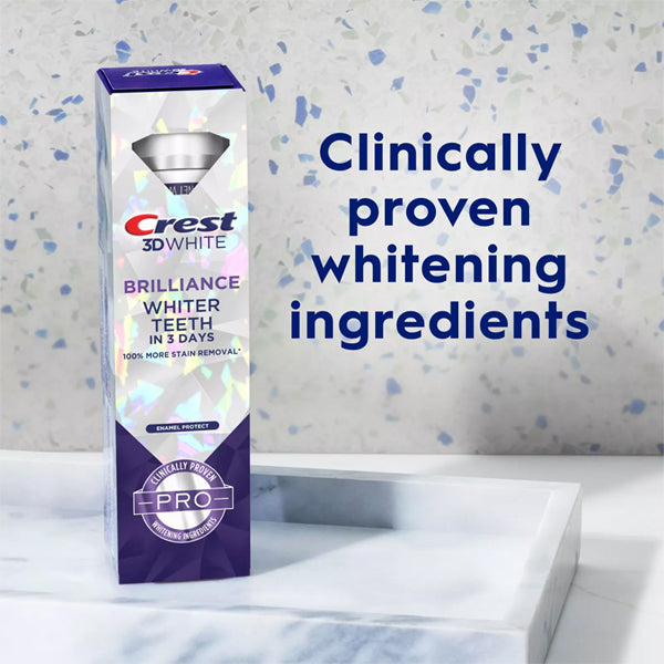 A 6 pack of Crest 3D White Brilliance Pro Enamel Protect Toothpaste 3oz on a counter with text: Enamel safe, clinically proven teeth whitening ingredients.