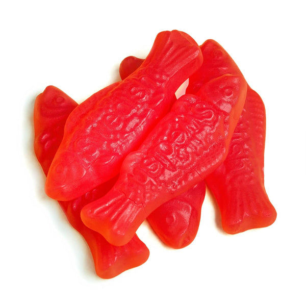 A pile of red, fish-shaped Swedish Fish candy from the 6 Pack - Swedish Fish Soft & Chewy Candy 8oz Bags is shown on a white background.
