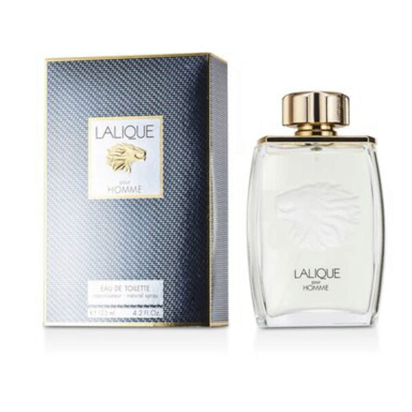 The Lalique Pour Homme Eau De Toilette for Men 4.2oz bottle is displayed alongside its blue and gold box, both adorned with a striking lion’s head emblem, reflecting the refined style of this Lalique fragrance.