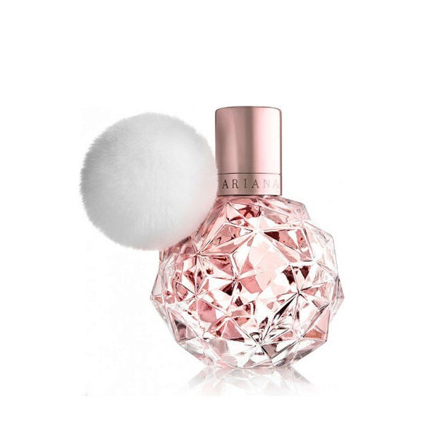 Ariana Grande Ari Eau De Parfum for Women 3.4oz features a faceted pink bottle with a metallic cap and fluffy white pom-pom. This floral fruity fragrance adds a playful touch to any perfume collection.