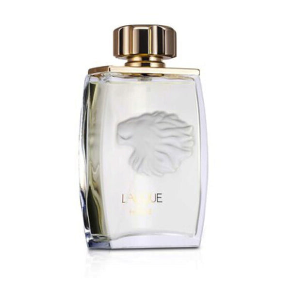 The Lalique Pour Homme Eau De Toilette for Men 4.2oz by Lalique comes in a clear glass bottle with a gold cap, embossed lion head design, and “Lalique Pour Homme” on the front, reflecting the bold spirit of this men’s fragrance.