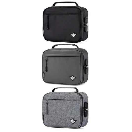 The Erozul Exodus v2 Smell Proof Case With Combination Lock by Erozul comes in black, dark gray, and light gray. Each rectangular case has a handle, front zipper pocket, logo patch, and an activated carbon lining for added freshness.