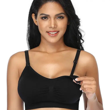 A woman models the GXXGE 4Pack Seamless Nursing Maternity Bra for Breastfeeding (Size 4XL) in black, with one strap unclipped to show the drop-down cup feature for easy nursing.