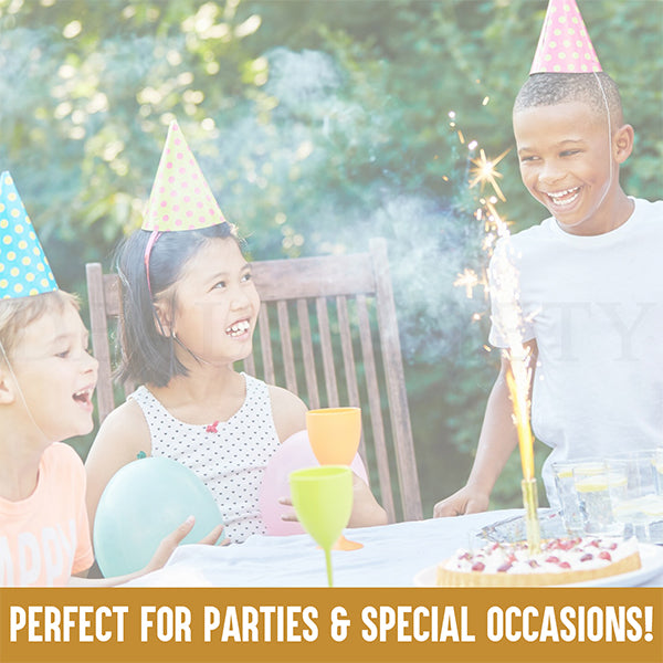 Three kids in party hats smile at an outdoor table with balloons, drinks, a cake with sparklers, and a bowl of Werther’s Original Hard Caramel Candy 2.5 lb Bulk Bag—individually wrapped—perfect for parties & special occasions!.