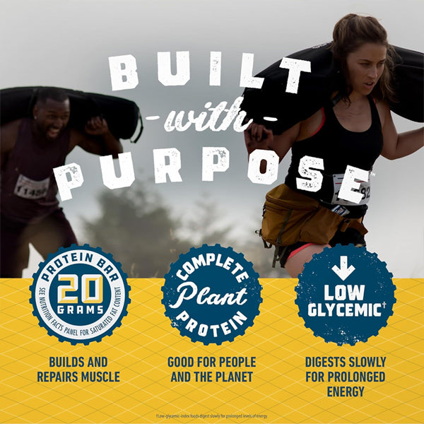 Two athletes carrying sandbags compete outdoors, while Clif BUILDERS Protein Bars Vanilla Almond Flavor provide 20g plant protein—gluten free, non-GMO—for strong muscles, sustained energy, and a better planet. 2.4oz bars, 12 count box.