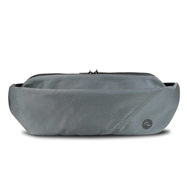 The Skunk Drifter Medium Crossbody Bag in Metal Gray features 100% smell and weather proof carbon lining, a textured surface, zip closure, and a small circular logo in the corner. Shown against a white background.
