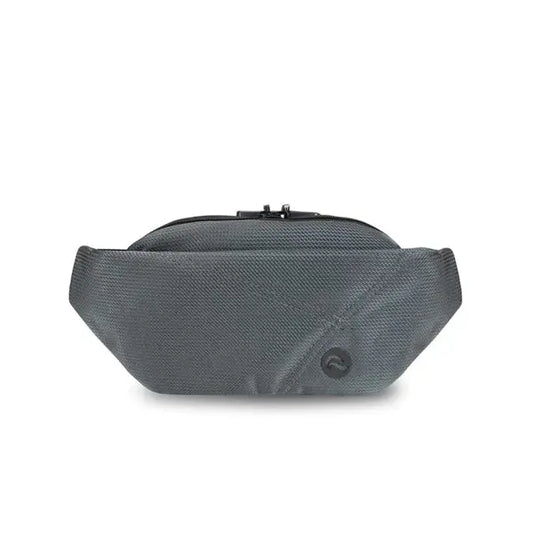 The Skunk Drifter Small Crossbody Bag in Metal Gray features 100% smell and weather proof carbon lining, a top zipper, gray fabric, and a small circular logo on the front for discreet storage.