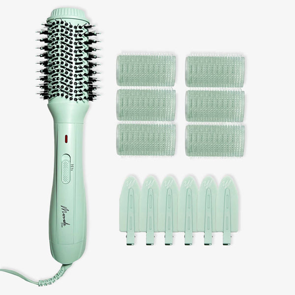 The Mermade Hair Thats Mint Three Piece Blowout Kit by Mermade Hair includes a mint green blow-dry brush, six matching hair rollers, and six clips—everything you need for a salon-worthy blowout at home.