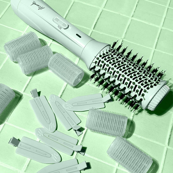 The Mermade Hair Thats Mint Three Piece Blowout Kit by Mermade Hair—featuring a round brush blow dryer, rollers, and clips—gives you all you need for a salon-worthy blowout at home.