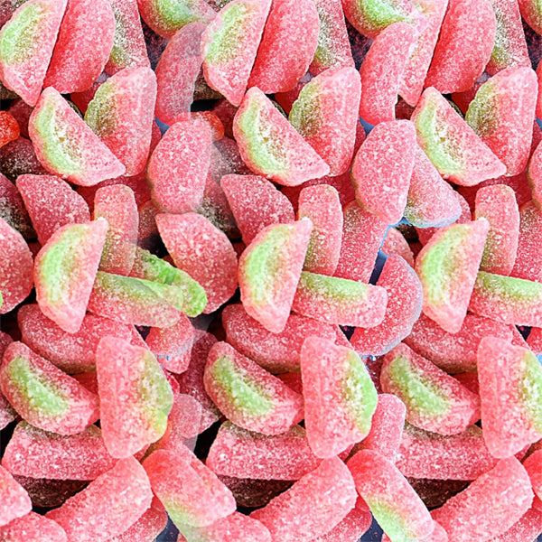Get a close-up look at Sour Patch Kids Watermelon Soft & Chewy Candy—24 count bulk pack of 2oz bags, featuring pink and green sugar-coated gummy slices bursting with watermelon flavor.