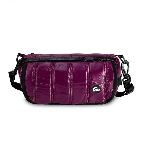 The Skunk Uptown Crossbody Duffle Bag features a rectangular shiny purple quilted design, black adjustable shoulder strap, a small white front logo, and 100% smell & weather proof carbon lining.