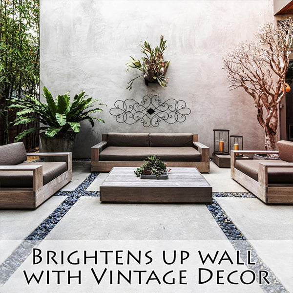 Modern patio with wooden furniture, potted plants, and Besti’s Wrought Iron Wall Art Decor for Living Room and Bedroom Medallion (32 x 12), featuring a decorative scroll-style design that adds vintage charm to the wall.