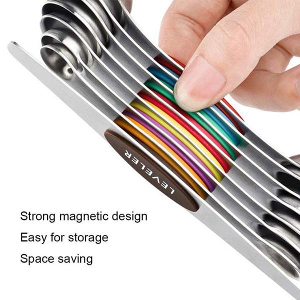 A hand holds Deal Society’s Magnetic Dual Sided Measuring Stainless Steel Spoons with Leveler (Set of 8), stacked for space-saving storage. Text: Strong magnetic design, Easy to store, Space saving.