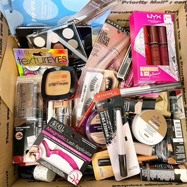 A cardboard box containing 50 assorted makeup products and beauty tools from Deal Society’s Wholesale Mixed Makeup & Beauty Tools collection.