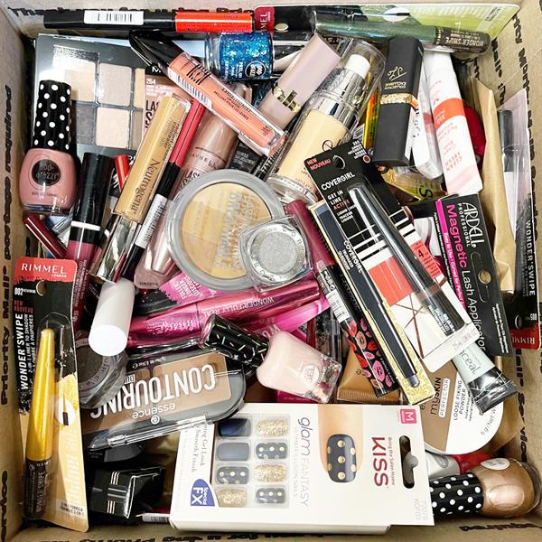 The Deal Society Wholesale Mixed Makeup & Beauty Tools - Lot of 50 Pieces includes assorted beauty tools, nail polishes, eyeshadow palettes, lipsticks, mascaras, nail wraps, powders, and packaged beauty items.