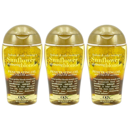 Three bottles of OGX Hydrate Color Reviving Sunflower Shimmering Blonde Penetrating Oil, featuring gold caps and yellow oil, to hydrate and enhance blonde hair with sunflower extract and UV filters.