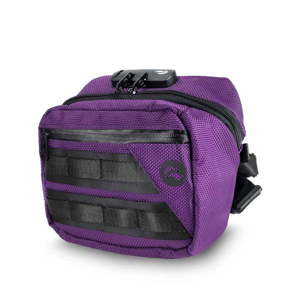 The Skunk Kross Stash Storage Bag is a compact purple nylon hybrid bag with black zippers, modular attachment points, a front pocket, and odor-eliminating carbon lining plus an airtight combo lock.