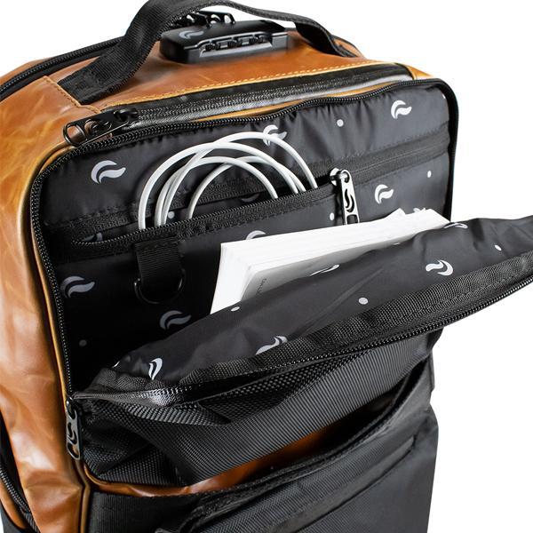 Close-up of the Skunk SoHo Smell Proof Weather Proof Back Pack by Skunk, showing a coiled charging cable and white papers inside an interior pocket with activated carbon lining for 100% odor proof storage.