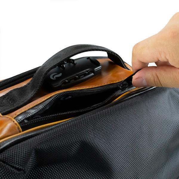 A hand unzipping a Skunk SoHo Smell Proof Weather Proof Back Pack with activated carbon lining, revealing a black computer mouse inside the odor-proof pocket.