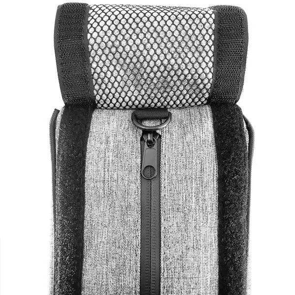 Close-up of a rolled-up Skunk Travel Pack 10 Smell Proof Bag by Skunk, featuring a mesh top, lockable center zipper, and black strap accents on both sides.