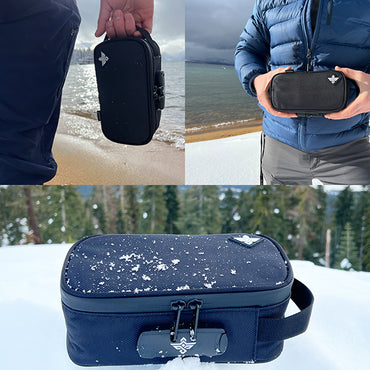 The Erozul Genesis v2 Medium Smell Proof Case With Combination Lock by Erozul is shown in black, held on a beach, carried in snow, and resting on snow with light flakes on top.