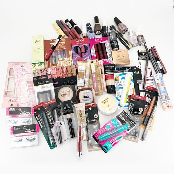 Deal Society Wholesale Mixed Makeup & Beauty Tools—Lot of 50 pieces featuring lipsticks, mascaras, eyeshadows, foundations, nail polishes, and essential beauty tools arranged on a white surface.